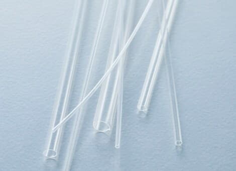 Translucent Junkosha FEP fluoropolymer tubing used for chemical resistance, electrical insulation, and heat-shrink protection